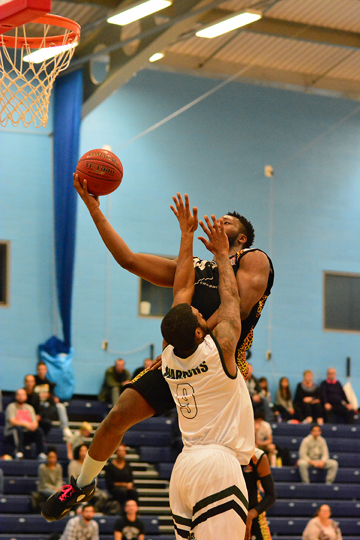 David Ajumobi playing for Essex Leopards in black shooting